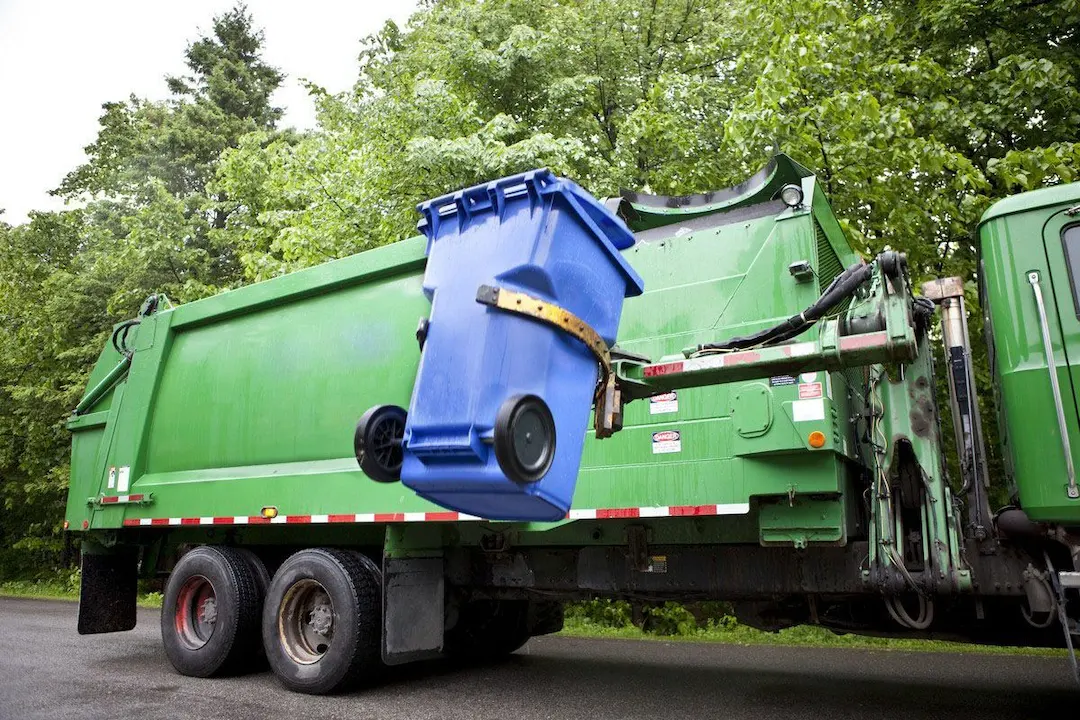 fees that garbage services may addon concept truck picking up can