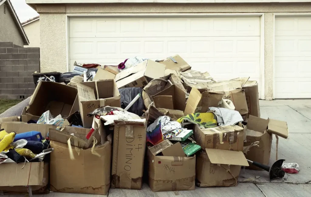 piles of boxes in front of garage door at home