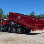 commercial roll off dumpster being unloaded from trash rangers