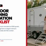 Wedding guests using a portable restroom trailer at an outdoor South Louisiana venue